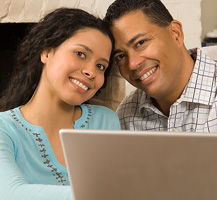 image of couple using laptop
