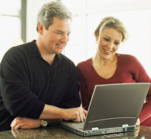 image of man and lady with laptop