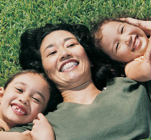image of smiling mom and kids