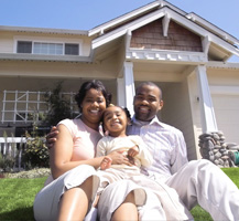 image of couple and daughter by home