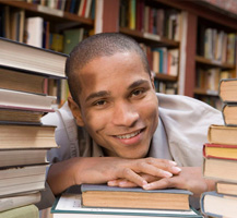 image of boy with school books